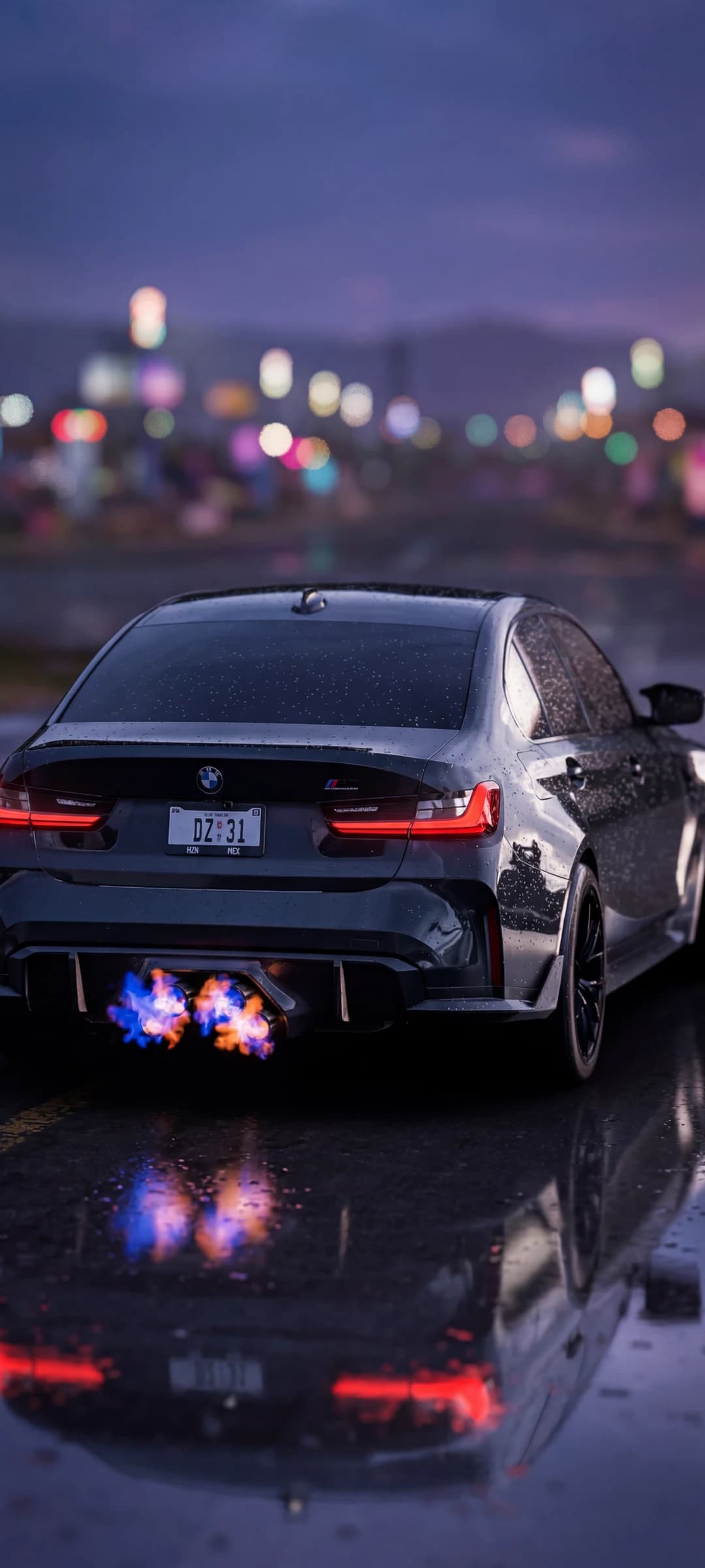 Sleek Black BMW M3 on Wet Surface